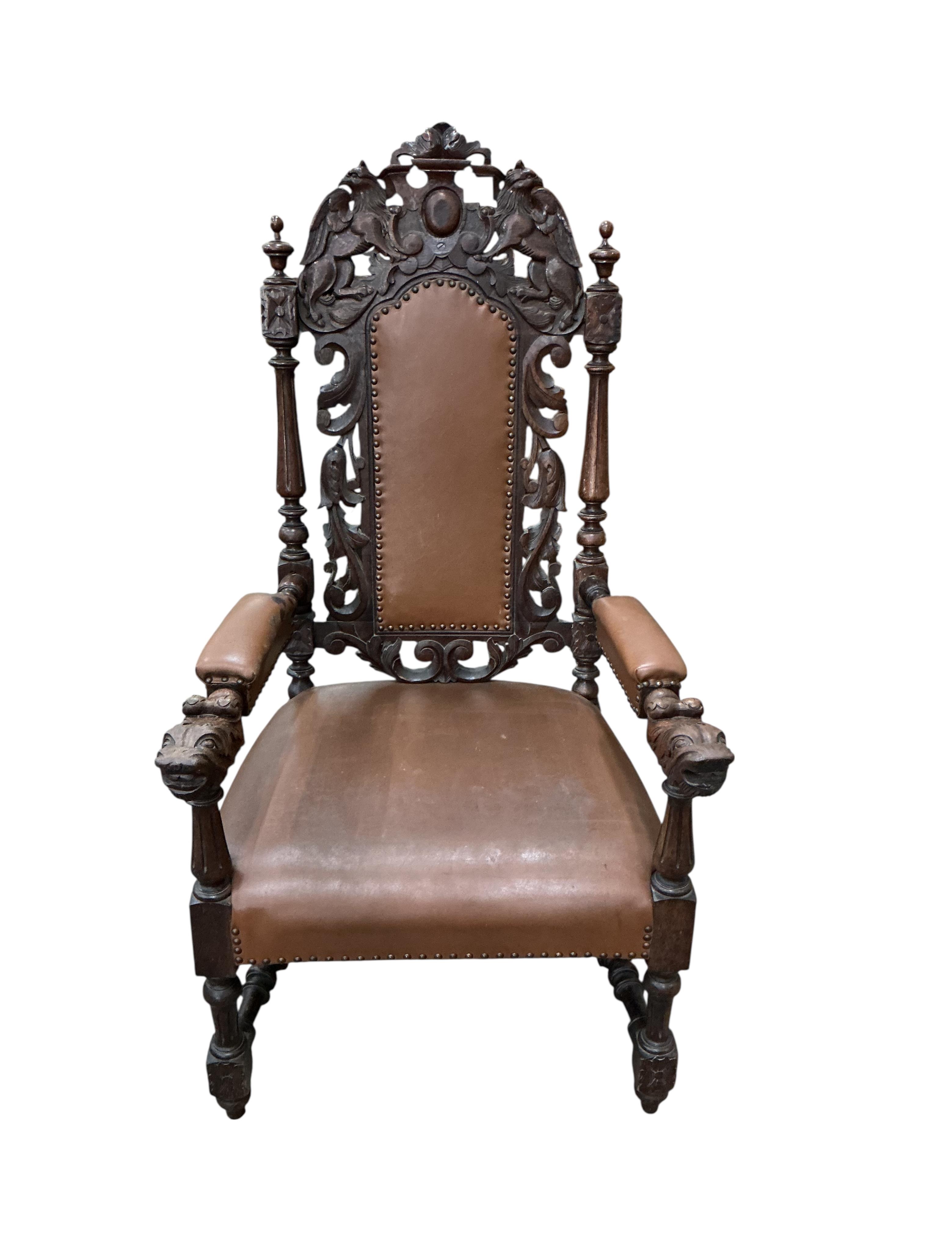 A late Victorian carved oak high backed elbow chair, width 66cm, depth 63cm, height 130cm
